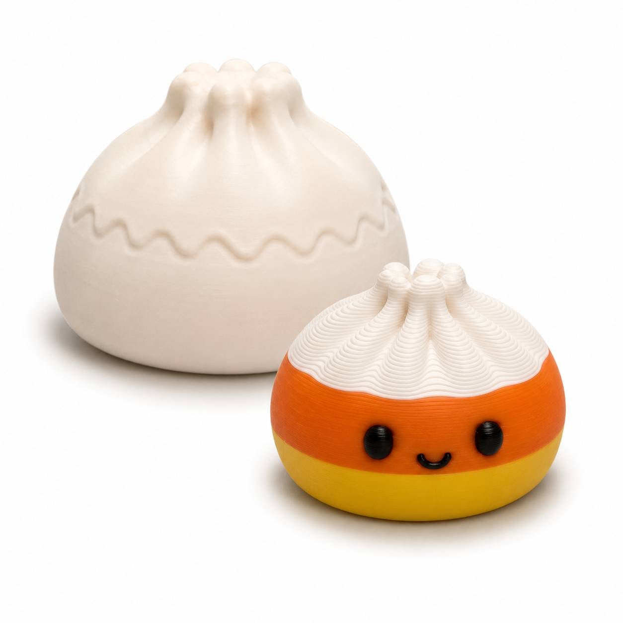 Candy Corn 22mm Mini Dumpling 3D printed bead in white orange and yellow shown with Original Dumpling for size comparison