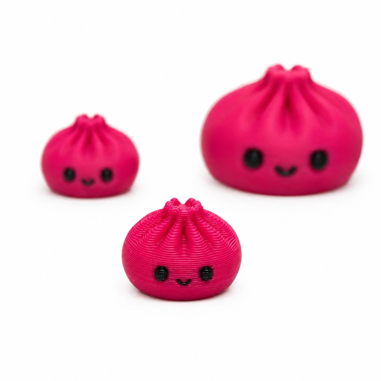 Pink Bitty Dimpling Pen Palz 3D printed bead featuring a smiling kawaii face in an approximately 15mm size.