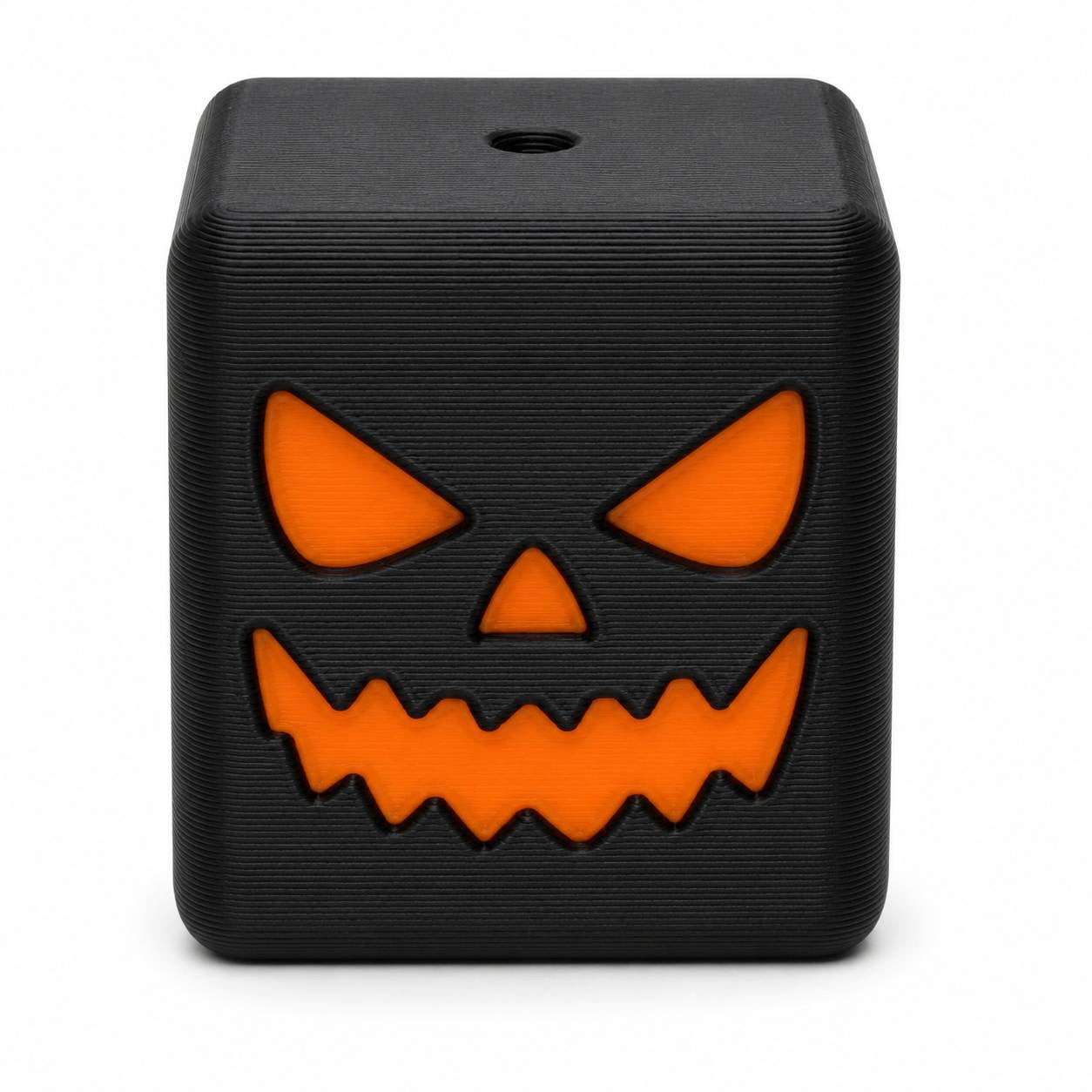 Jack Attack black cube 3D printed Halloween bead with orange jack-o-lantern face