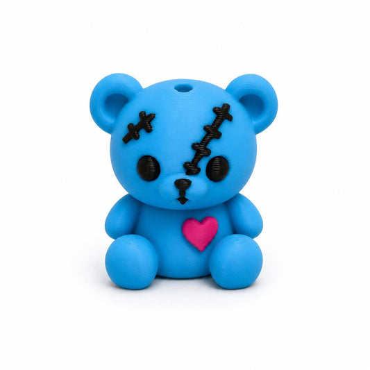 Blue Skye Pen Palz 3D printed stitched teddy bear bead with embroidered-inspired details and a pink heart by Bailey's Beads for beadable pens, keychains, badge reels, and DIY crafts.