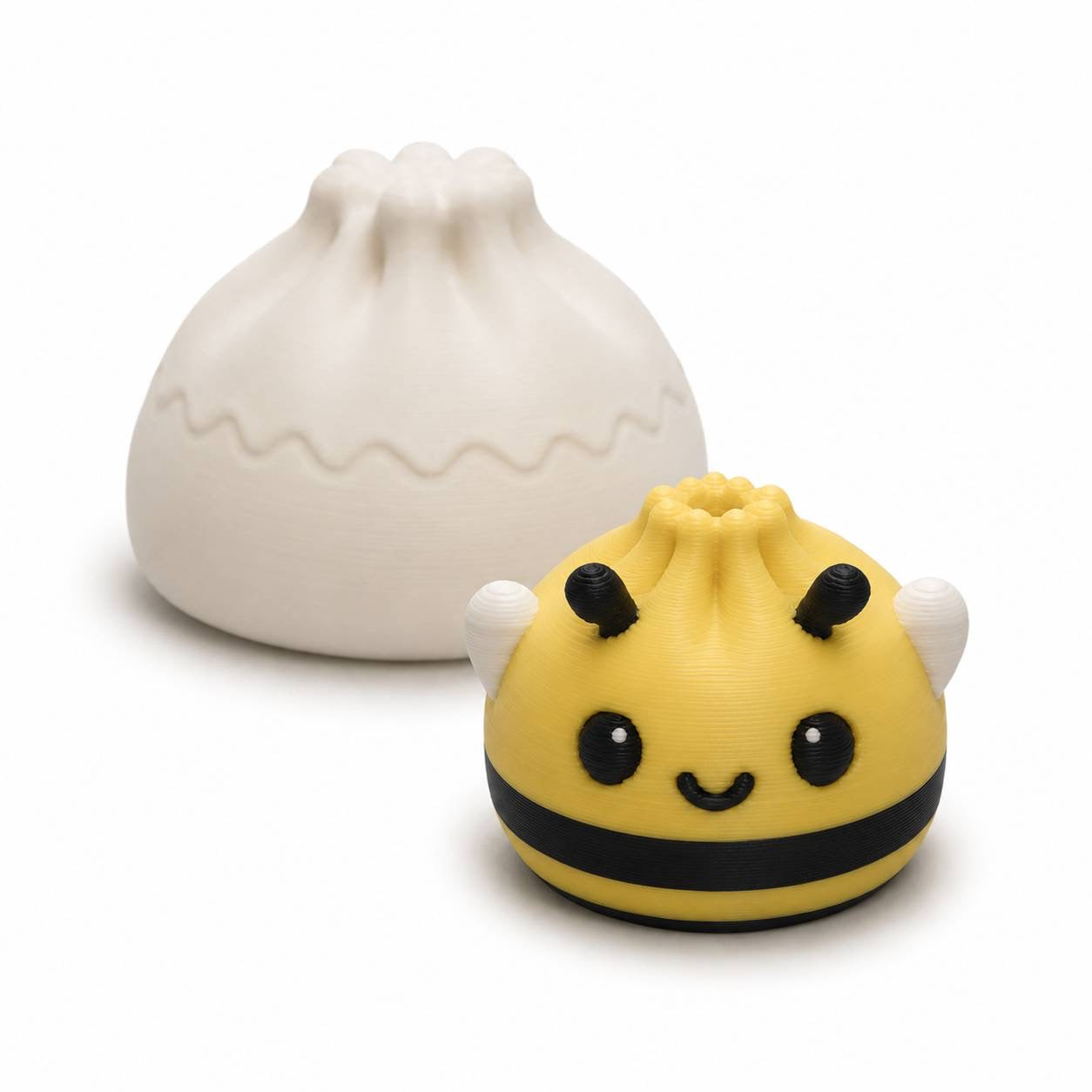 Bee Mini Dumpling 22mm 3D printed bead with yellow body, black stripes and white wings shown with Original Dumpling for size comparison