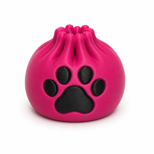 Bright pink Pink Paws Dumpling 3D printed bead with large black paw print by Bailey’s Beads.