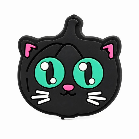Cute black cat Halloween focal bead featuring oversized green eyes, pink ears, and a sweet expression.