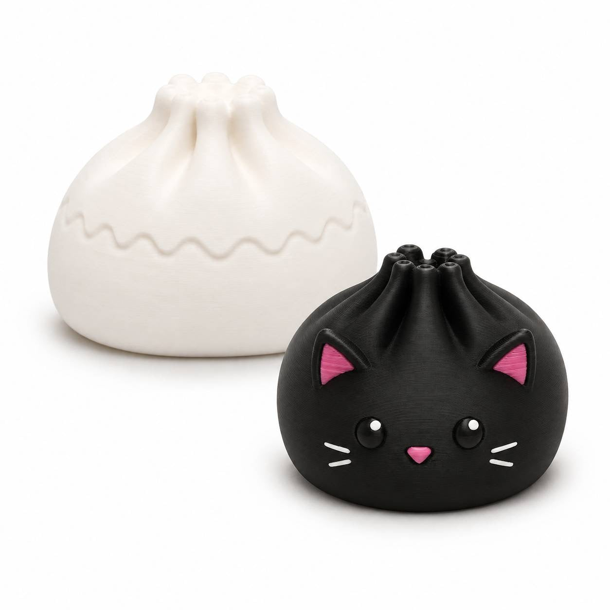 Black Cat Mini Dumpling 22mm 3D printed bead with pink ears and white whiskers shown with Original Dumpling for size comparison