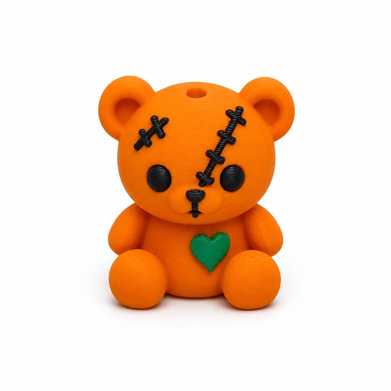 Orange Pumpkin Patch Pen Palz 3D printed stitched teddy bear bead with embroidered-inspired details and a green heart by Bailey's Beads for Halloween beadable pens, keychains, badge reels, and DIY crafts.