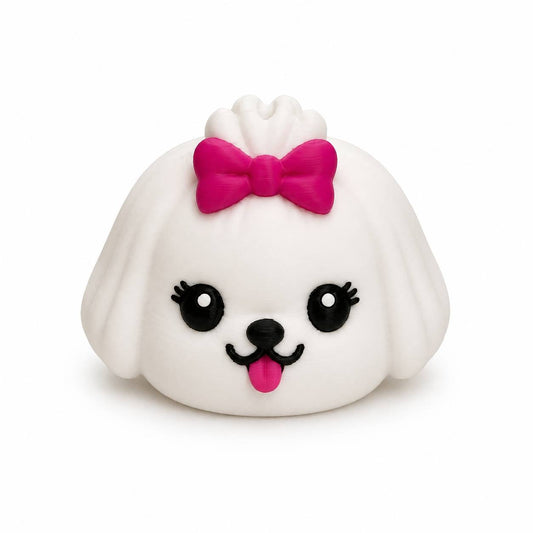 White Maltese Dumpling 3D printed dog bead with floppy ears, pink bow, and cute kawaii face by Bailey’s Beads.