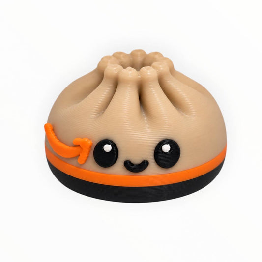 Prime Time Dumpling 3D printed bead featuring a tan dumpling with orange and black football-inspired details and a cute smiling face.