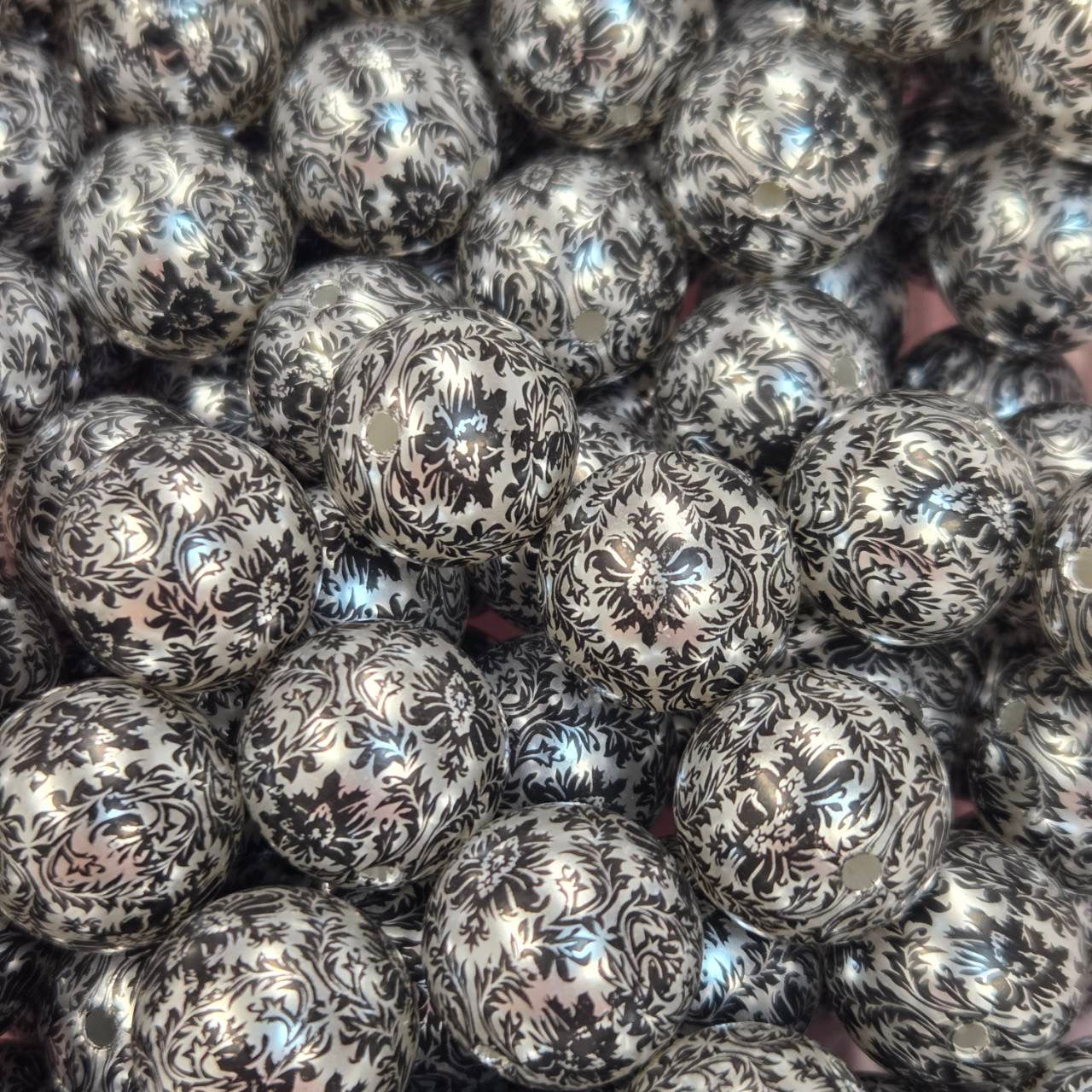 20mm acrylic bead featuring a black damask floral pattern on a pearl white background
