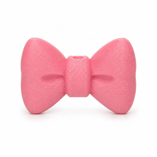 Pink Glitter 3D Printed Bow by Bailey's Beads for decorating Pen Palz, badge reels, keychains, ornaments, and DIY craft projects.