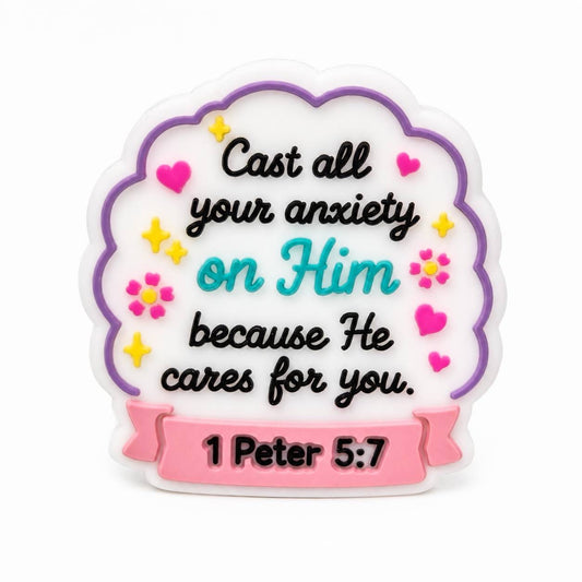Christian silicone focal bead featuring the Bible verse from 1 Peter 5:7, "Cast all your anxiety on Him because He cares for you," with colorful floral and heart accents.