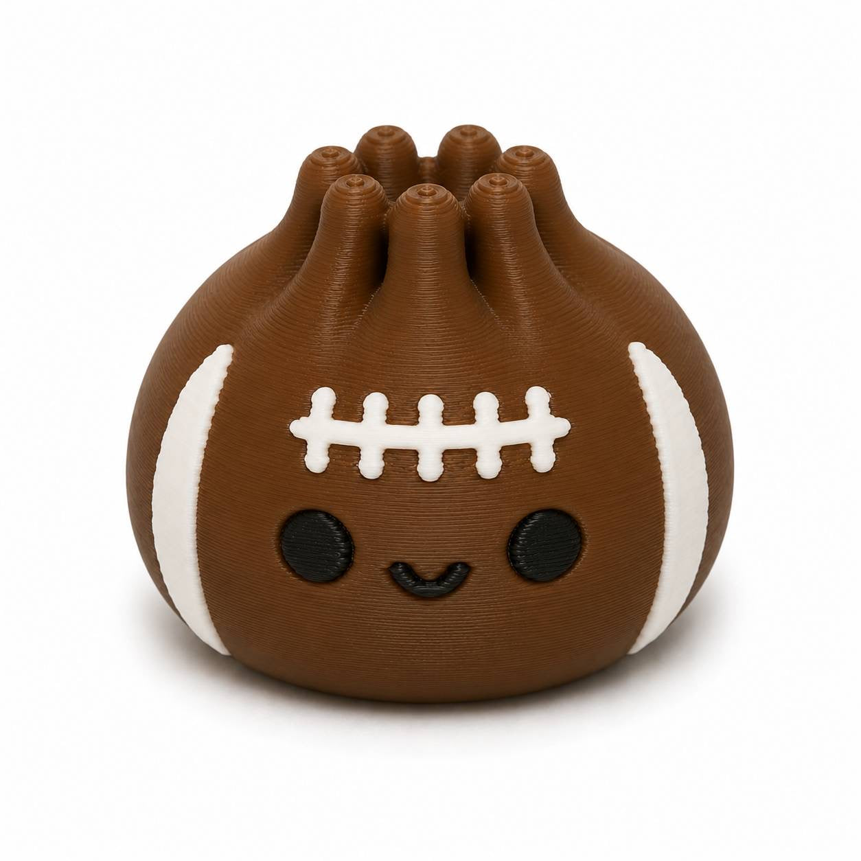 Brown Blitz Dumpling Pen Palz 3D printed football-inspired bead with classic white football stripes, stitched laces, and a kawaii smile by Bailey's Beads for beadable pens, keychains, badge reels, and DIY crafts.