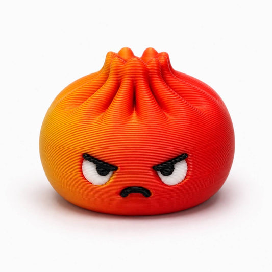 Orange and red Angry Dumpling Pen Palz 3D printed bead with a kawaii frowning face, furrowed brows, and a grumpy expression.