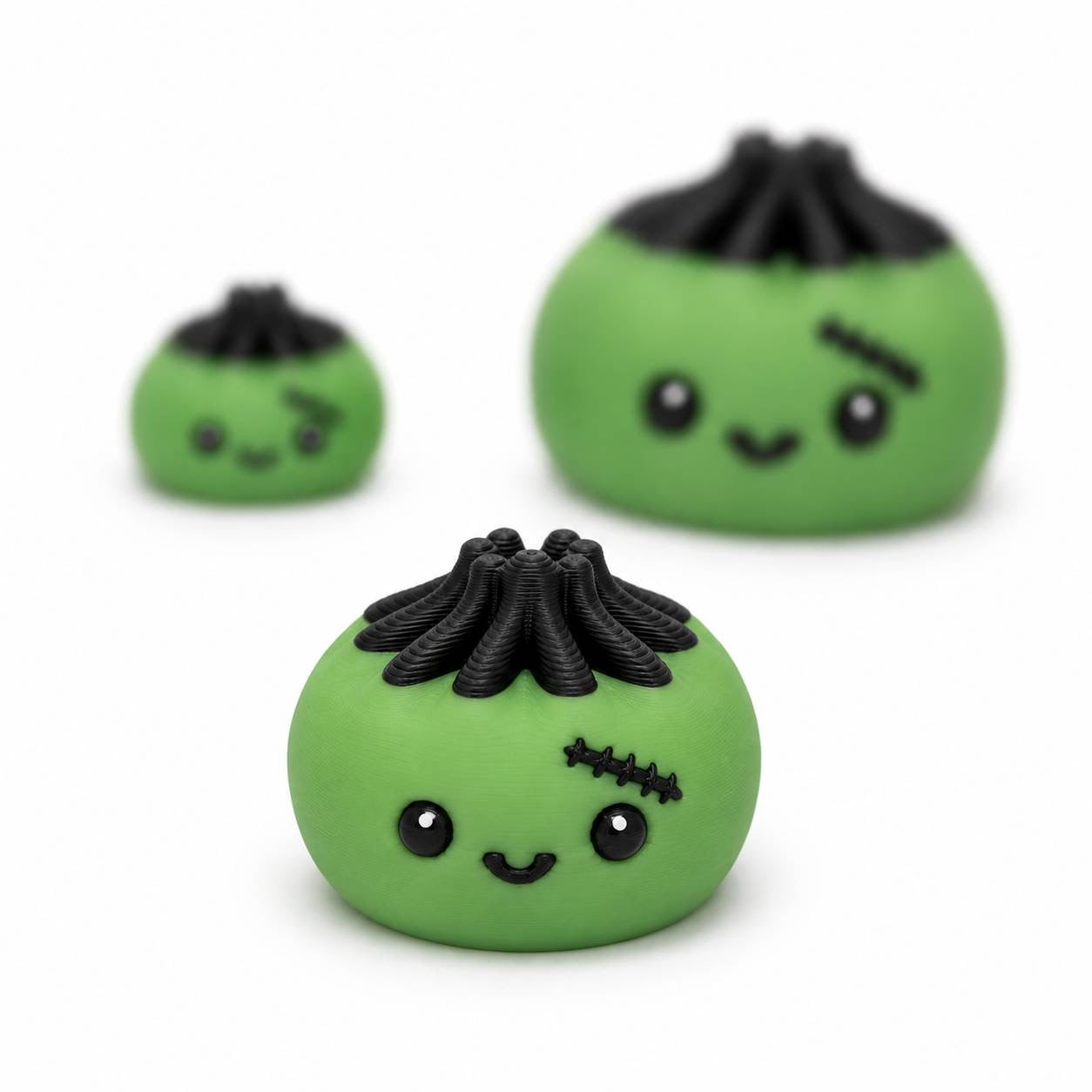 Green Frankie Dimpling Pen Palz 3D printed bead featuring black hair, stitched details, and a cute smiling face in an approximately 20mm size.