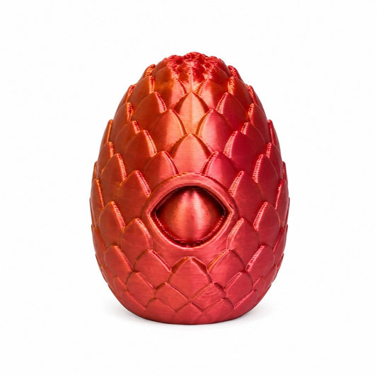 Ember Eye shimmering red orange 3D printed dragon egg bead with scale texture and eye