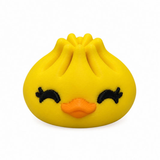 Yellow Ducky Dumpling 3D printed bead with orange bill and closed eyes